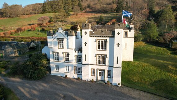 Bolfracks House & Gardens in Rural Scotland - Grand white building amongst green fields and forest
