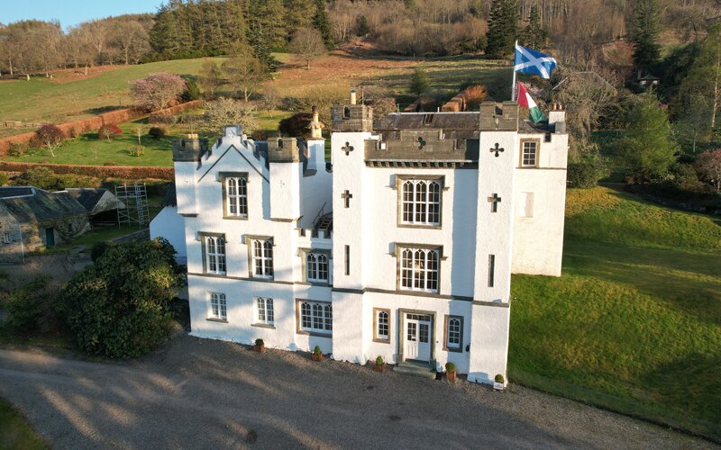 Bolfracks House & Gardens in Rural Scotland - Grand white building amongst green fields and forest