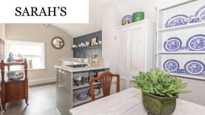 Case Study of Sarah's selfcatering apartment - Dining table in a light room, with a kitchen in the background. Case Study of Sarah's selfcatering apartment - Dining table in a light room, with a kitchen in the background.