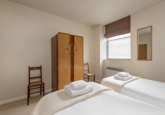 Bedroom in a City Break Apartment