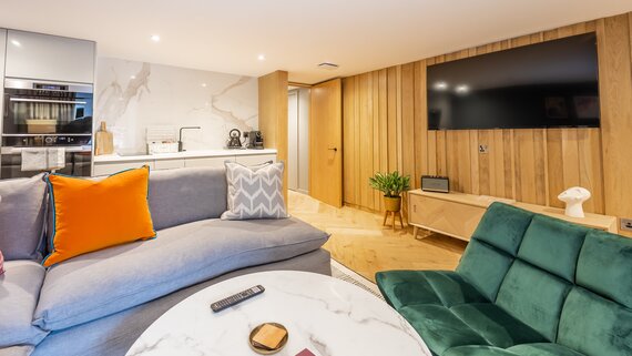 Living Room - Superb open-plan living room and a fully equipped kitchen with a clean, contemporary design.