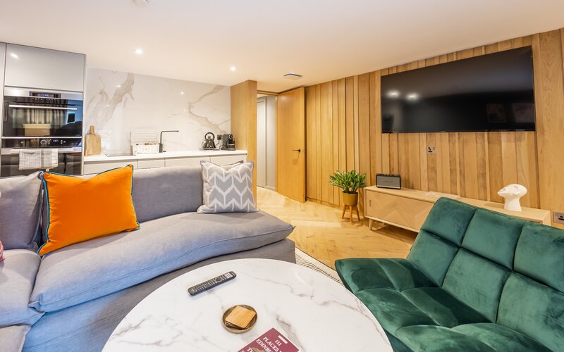 Living Room - Superb open-plan living room and a fully equipped kitchen with a clean, contemporary design.