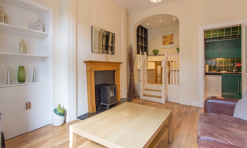 BroughtonRoad_001 - Family living room with raised dining area and coal effect fire