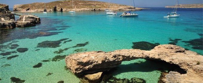 Crystal blue Gozo waters - Holidays to Gozo are ideal for swimming, diving, snorkelling, kayaking, sailing and much more in the blue Mediterranean waters.