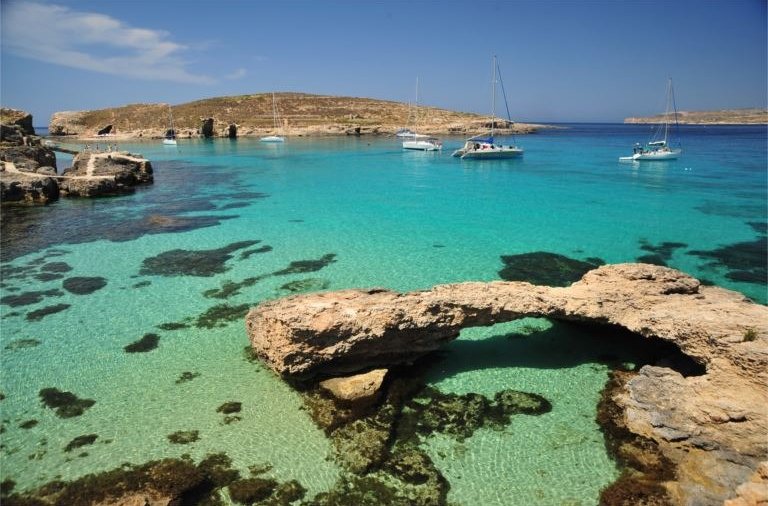 Crystal blue Gozo waters - Holidays to Gozo are ideal for swimming, diving, snorkelling, kayaking, sailing and much more in the blue Mediterranean waters.