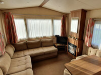 Lounge with TV and Fireplace and Dining Area