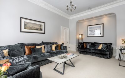 Lounge Area in a Self-Catered Apartment - Stylish lounge area with comfortable sofas, to unwind after a long day in the city of Edinburgh