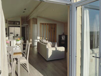 Entrance from the veranda to the dining area in the holiday lodge