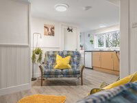 Open plan lounge, kitchen and breakfast bar in studio near Newby Bridge