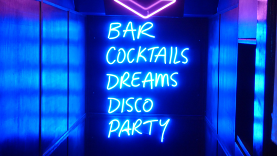 Edinburgh nightlife spots - Lights lit up with the words Bar, Cocktails, Dreams, Disco, Party