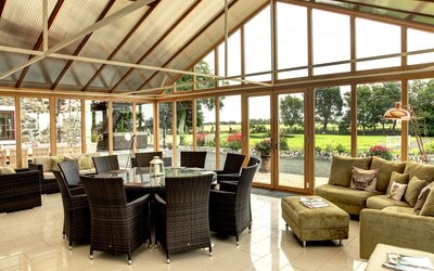 Conservatory in a Holiday Let in Scotland - Bright and spacious conservatory, offering elegant seating and dining facilities surrounded by natural light