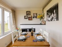 Dining table with blue china and countryside views