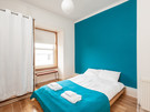 Lothian Road 4 - Double bedroom with feature blue wall in Edinburgh holiday let
