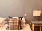 High Street (Royal Mile) 2 - Decorative cushions on double bed in city centre Edinburgh holiday let