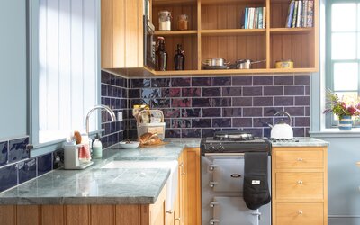 Kitchen in a Self-Catered Cottage - State-of-the-art kitchen equipped with high-spec appliances, sleek countertops and ample storage space