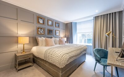 Bedroom - A sleek and modern sleeping area with a comfortable, high-quality king-size bed. The space is bright and airy, featuring contemporary décor with stylish accents for a restful stay.