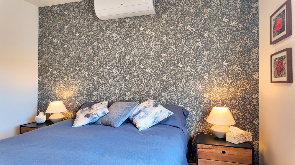 Cozy Bedroom With Floral Wallpaper