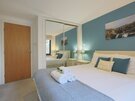 Master Bedroom - Master bedroom with king size bed, and double mirrored wardrobes in self catered accommodation, Edinburgh.