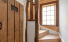 Wooden staircase with original beams