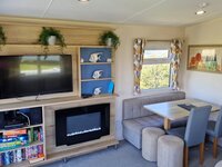 Lounge with TV and Fireplace and Dining Area