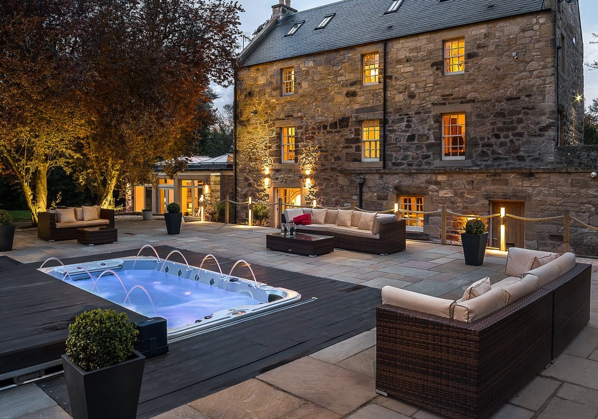 Why choose a holiday home? - Large stone self catering home with outdoor hot tub.