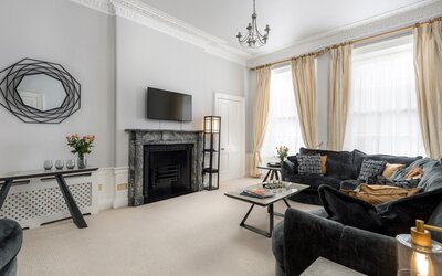 Spacious Living Room in a Holiday Rental - A grand and sophisticated period living room that masterfully combines traditional regal details with contemporary comfort