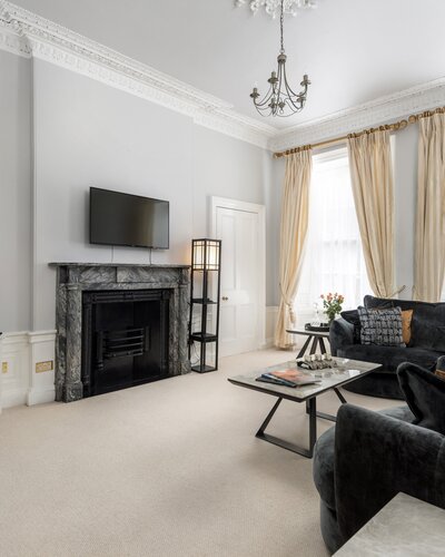Spacious Living Room in a Holiday Rental - A grand and sophisticated period living room that masterfully combines traditional regal details with contemporary comfort