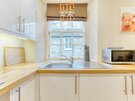 Gloucester Lane 13 - Contemporary, gleaming white kitchen within New Town Edinburgh holiday apartment.