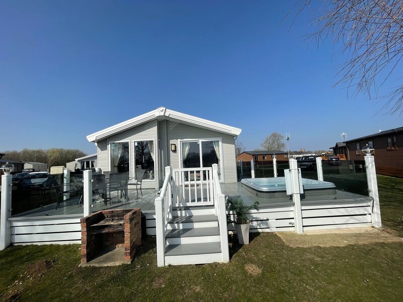front lodge view with bbq and balcony