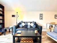 Living area with large leather sofa.