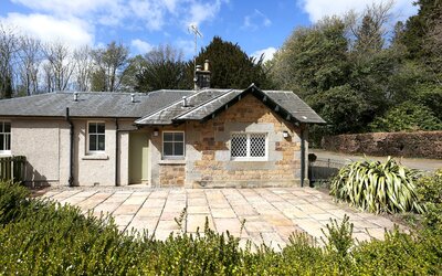 Copy of Gilmerton Lodge _004_Low - A charming single-storey cottage with period charm, surrounded by an expansive mature garden, a private driveway with parking for four cars and a peaceful, countryside setting within Gilmerton House’s grounds.