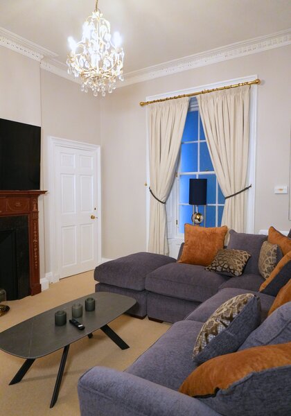 Elegant Living Room with Chandelier – Edinburgh Apartment