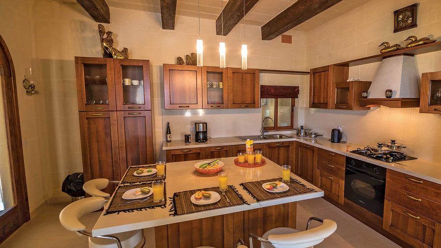 Gladjola's family kitchen - A typical farmhouse kitchen with traditional wooden oak beams that continue throughout this holiday home.