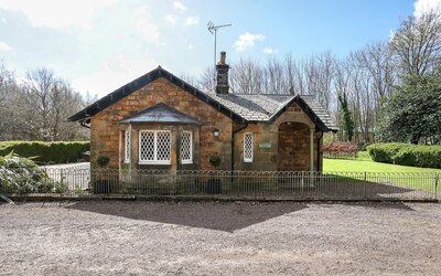 Copy of Gilmerton Lodge _001_Low - A charming single-storey cottage with period charm, surrounded by an expansive mature garden, a private driveway with parking for four cars and a peaceful, countryside setting within Gilmerton House’s grounds.
