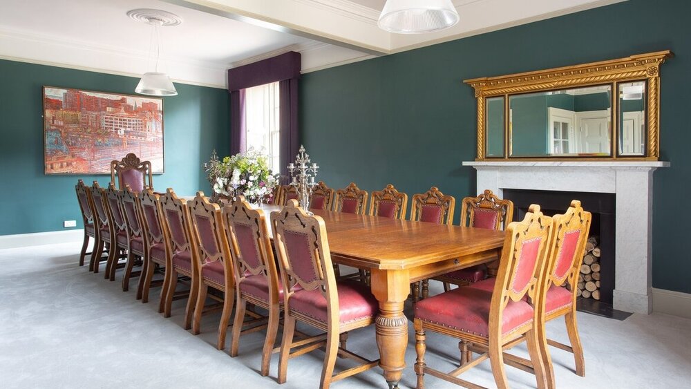 Papple Farmhouse Dining Room - Luxurious dining room with seating for 21 guests on traditional wooden seats.