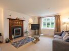 Primrose Cottage - sitting room - Sitting room at Primrose Cottage, a self-catering holiday let in Gullane, featuring a gas fire and TV