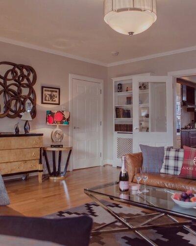 Cosy Lounge with Light Grey and Warm, Brown Touches - Stylish lounge area with comfortable sofas, to unwind after a long day in the city of Edinburgh