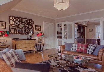 Cosy Lounge with Light Grey and Warm, Brown Touches - Stylish lounge area with comfortable sofas, to unwind after a long day in the city of Edinburgh