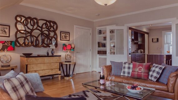 Cosy Lounge with Light Grey and Warm, Brown Touches - Stylish lounge area with comfortable sofas, to unwind after a long day in the city of Edinburgh