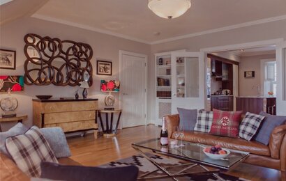 Cosy Lounge with Light Grey and Warm, Brown Touches - Stylish lounge area with comfortable sofas, to unwind after a long day in the city of Edinburgh