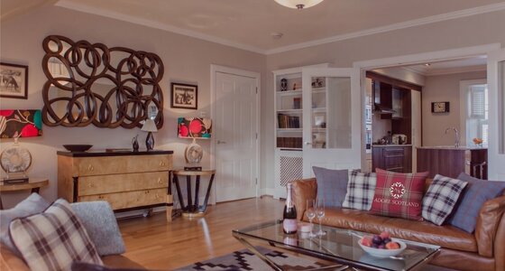 Cosy Lounge with Light Grey and Warm, Brown Touches - Stylish lounge area with comfortable sofas, to unwind after a long day in the city of Edinburgh