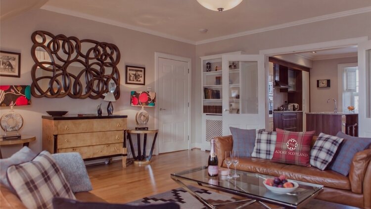 Cosy Lounge with Light Grey and Warm, Brown Touches - Stylish lounge area with comfortable sofas, to unwind after a long day in the city of Edinburgh