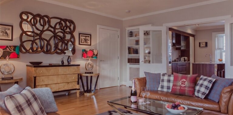 Cosy Lounge with Light Grey and Warm, Brown Touches - Stylish lounge area with comfortable sofas, to unwind after a long day in the city of Edinburgh