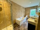 Ensuite Bathroom in a Rural Retreat - A spacious family bathroom featuring both a relaxing bath and a shower