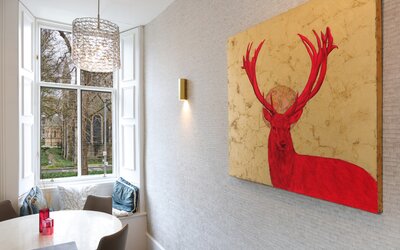 Dining area - Detail of dining area, featuring wall art and window seat