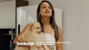 Provide dog treats for a doggy welcome pack - A photo of a long haired woman holding a fluffy dog.