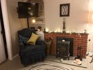 image00005 - Comfortable armchair and wood burning stove in family living room