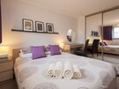 Master Bedroom - Master bedroom with king-size bed and mirrored double wardrobe in Edinburgh holiday home.