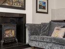 Living Room - Beautiful, sumptious sofa and feature fireplace in Edinburgh holiday home.