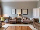 Spacious Self Catering Let in Edinburgh - Stylish lounge area with comfortable sofas and delightful artwork, to unwind after a long day in the city of Edinburgh